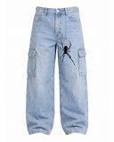 Bold back graphic artwork on men's Y2K baggy denim jeans, detail view