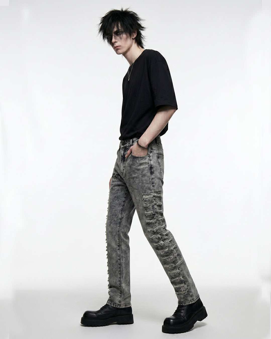Men's acid wash grey skinny jeans styled with boots, full look