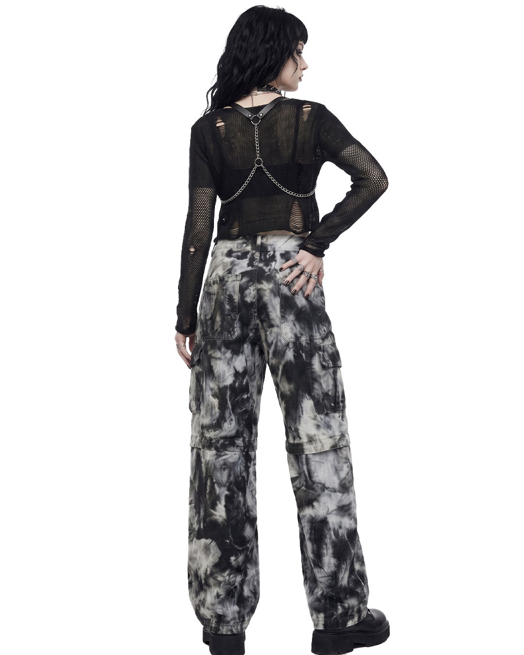 Back view of a model wearing women’s tie dye wide leg cargo pants with a relaxed fit.