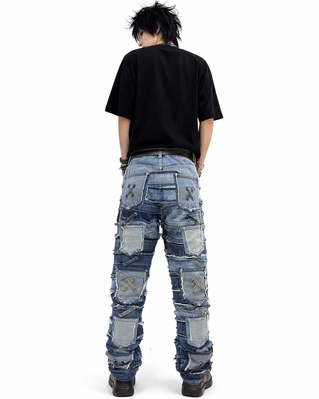 Patchwork distressed denim jeans with layered panel design, worn-in ripped detailing, and bold streetwear-inspired styling.