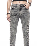 Close-up of grey skinny jeans women waistband with Venom logo print and shredded denim rips
