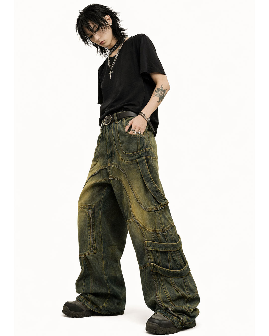 Mens baggy cargo jeans in washed dark denim with wide-leg fit, utility straps, curved seam panels, and streetwear styling shown in product and model view.