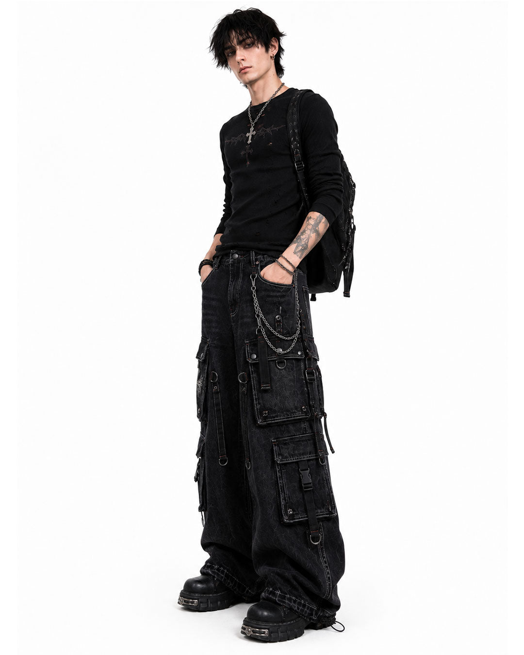 Male model wearing black grunge cargo pants side pose