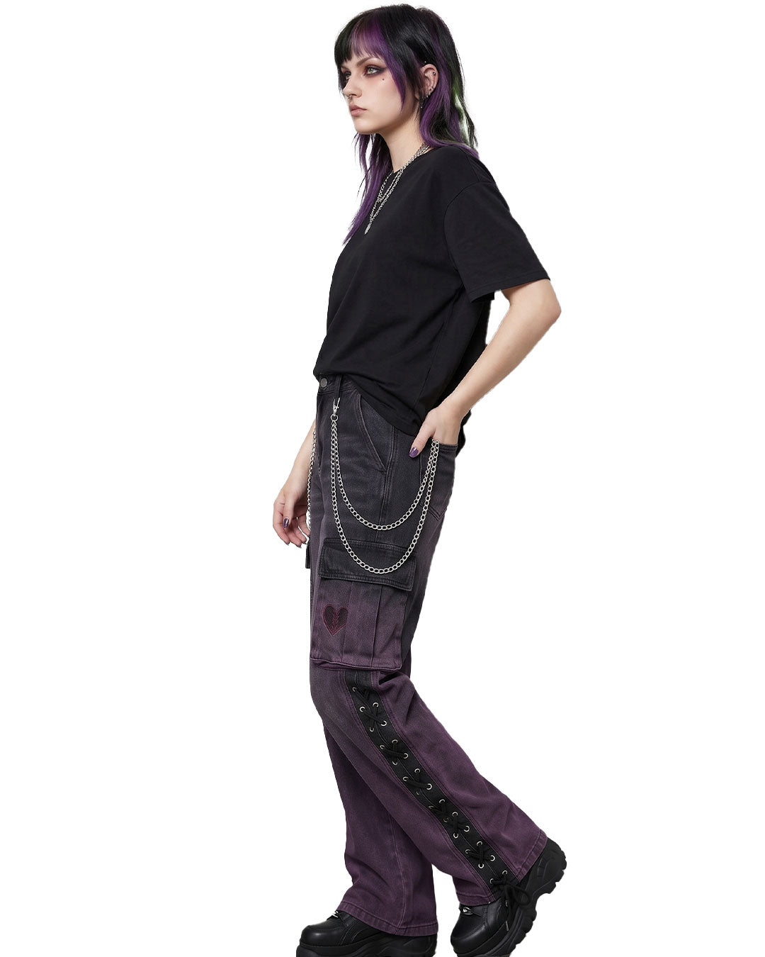 Side view of grunge denim cargo pants showing lace-up panel and wide-leg fit