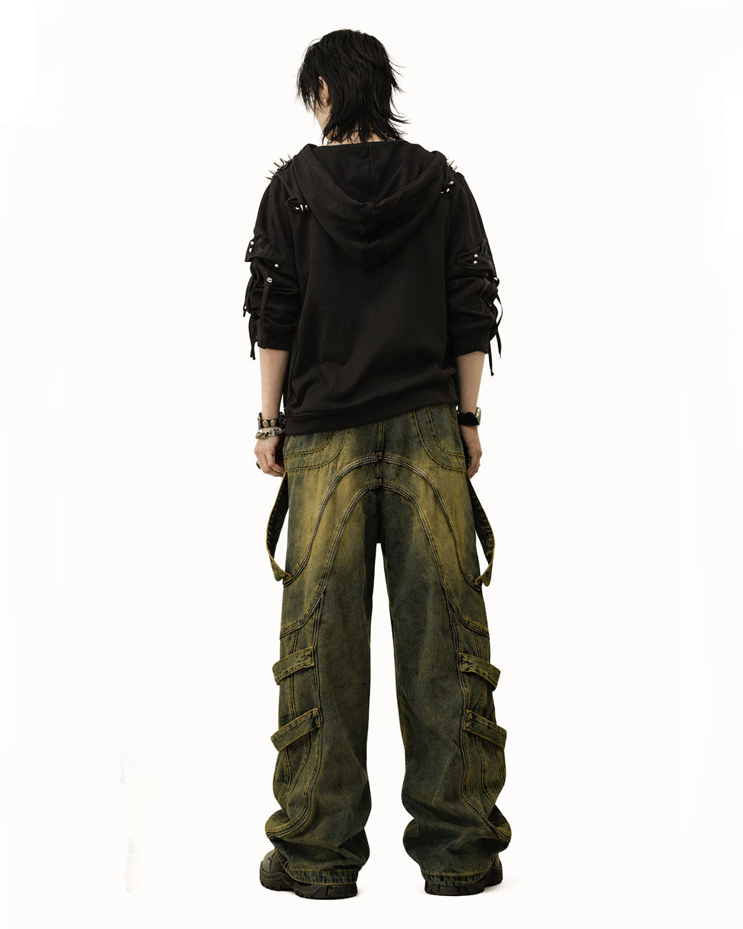 Mens baggy cargo jeans in washed dark denim with wide-leg fit, utility straps, curved seam panels, and streetwear styling shown in product and model view.