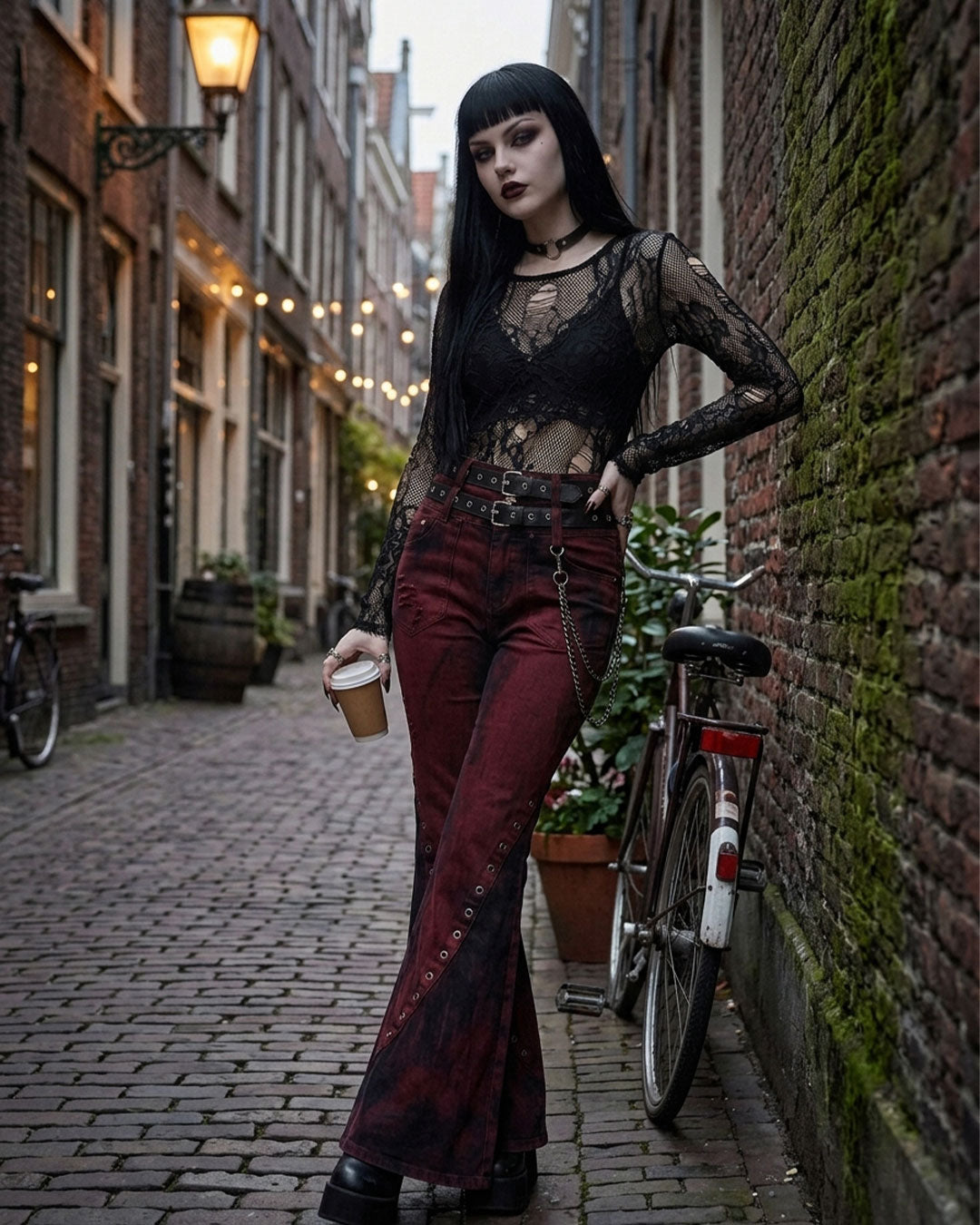 Flare pants women gothic bell bottom jeans lifestyle shot against wall