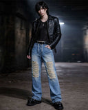 Distressed baggy jeans for men in light blue denim with ripped front panels and bold black graphic artwork on the back leg, shown front and back.