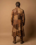 Men's brown leather pirate trench coat with rugged patchwork design and tattered hem