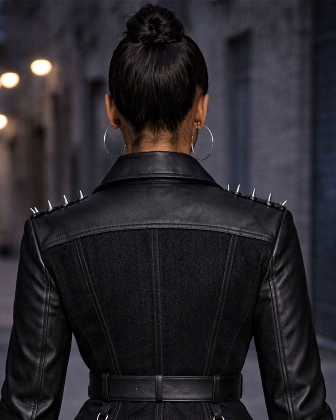 Women's punk leather jacket rear view showing fitted cut