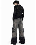 Mens wrangler cargo jeans in washed grey-black denim with baggy wide-leg fit and oversized utility pockets shown in front and back view.