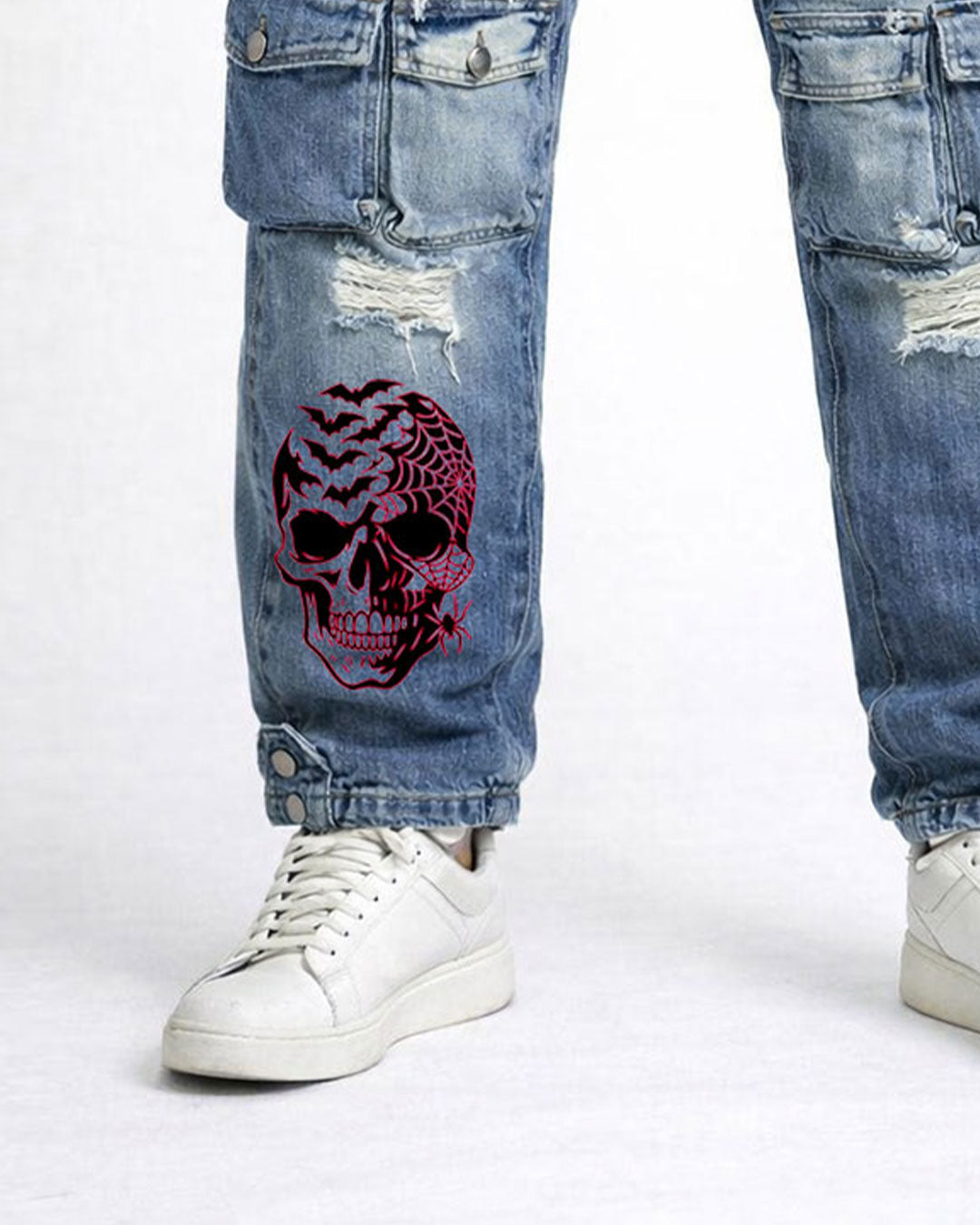 Close-up of pink graphic artwork on women's Y2K cargo jeans