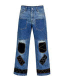 Black patchwork denim jeans with distressed finish, multi-pocket utility design, and wide-leg streetwear fit.