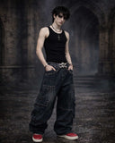 Men wearing wide leg denim pants with relaxed gothic fit in urban streetwear style